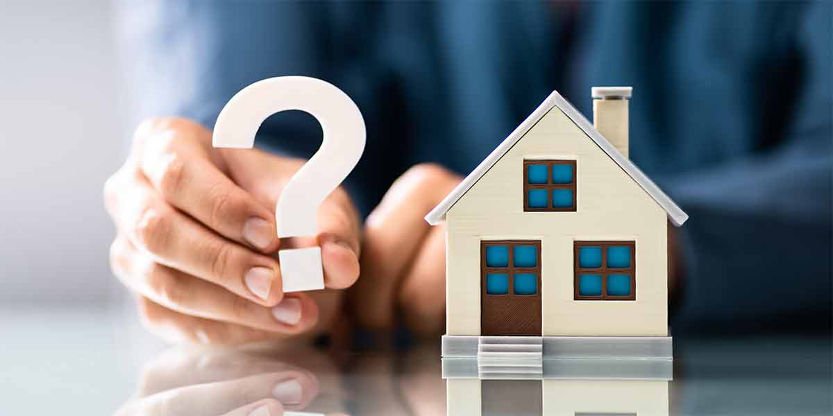 Holding a question sign wondering about common title problems and how to resolve them